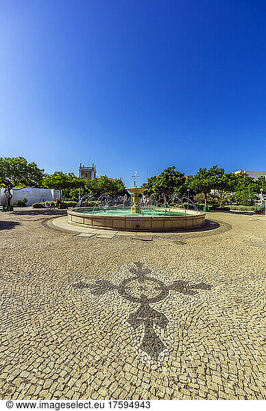 Cape Verde Â SaoÂ Vicente  Mindelo  Clear summer sky over cobblestone square with fountain in center