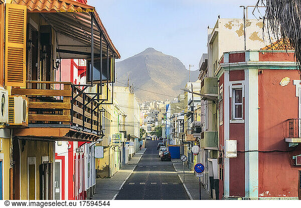 Cape Verde  Sao Vicente  Mindelo  Empty city street with house balcony in foreground and mountain in background