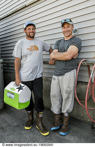 Captain Shaun McLennon (left) and sternman Ryan Feener of the lobster boat 'Horizon' at the Spruce Head Fisherman's Co-op in South Thomaston  Maine.