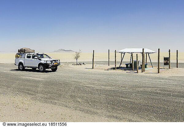 Car at parking lot on desert  Namibia  Africa