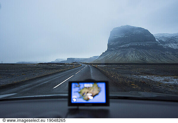 Car driving along foggyÃ?Â Ring Road  Iceland