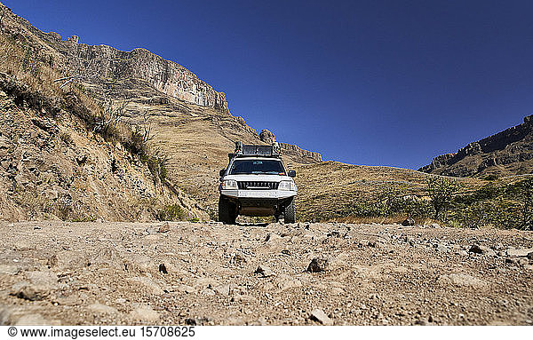 Car driving through mountains  Sani Pass  Lesotho