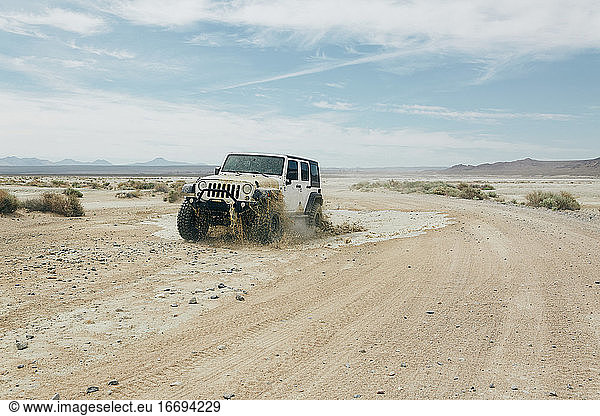 Car off-roading in California desert.