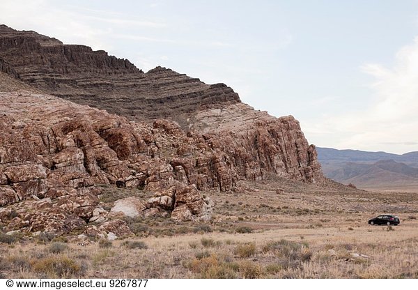 Car parked near rock formation  Ibex  Utah  USA