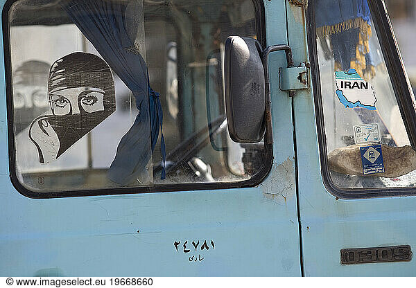Car sticker of Muslim woman with headscarf in Astara  Iran.