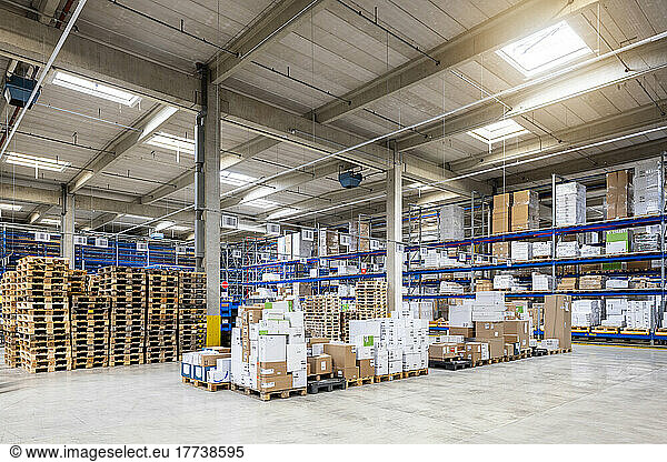 Cardboard boxes arranged in warehouse