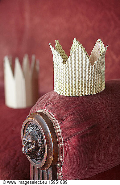 Cardboard crown on lounge chair