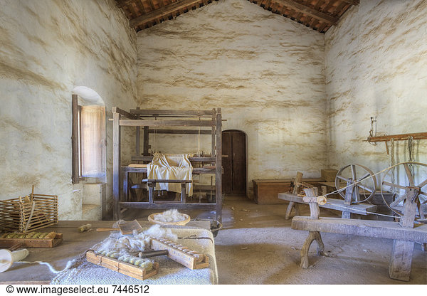 Carding and Spinning Wool  Weaving yarn into cloth on loom  Mission La Purisima State Historic Park  Lompoc  California  Founded in 1787  the eleventh mission of the twenty-one Spanish Missions established in California