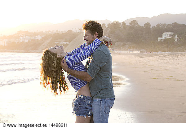 Carefree Mid-Adult Couple at Beach