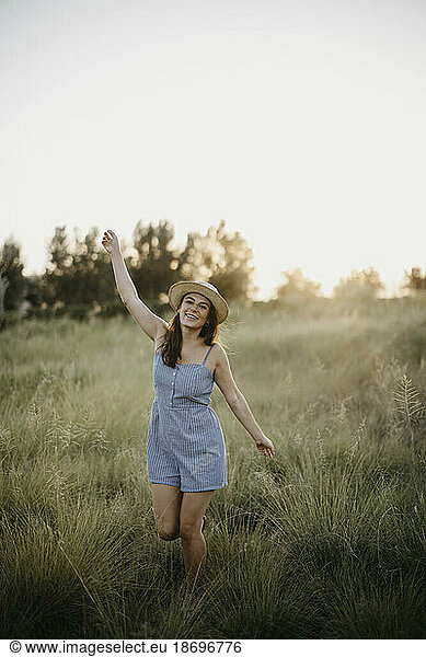 Carefree woman enjoying in field