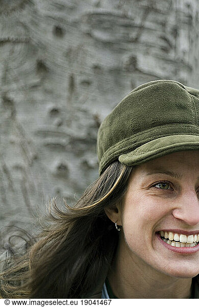 Carefree woman relaxes in urban park  Boston  MA.
