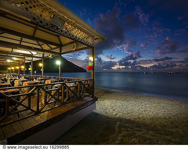 Caribbean  Lesser Antilles  Saint Lucia  restaurant at beach  Rodney Bay at dusk