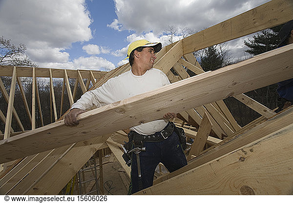 Carpenter building a house