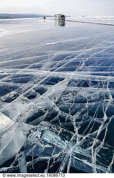 Cars on ice on the surface of Lake Baikal  Siberia  Russia