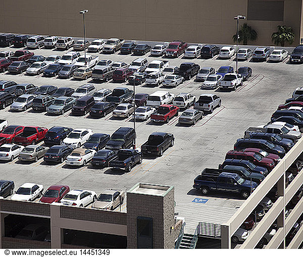 Cars parked on rooftop parking structure