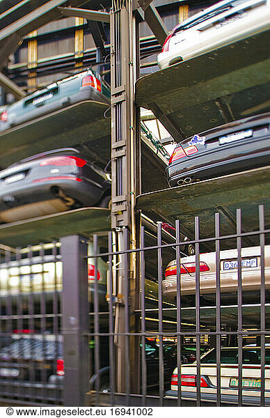 Cars stored in metal lift.
