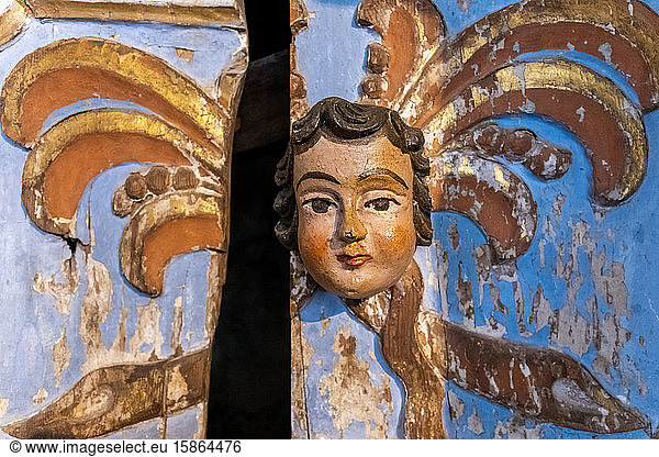 Carved head on wooden door  Tavira  Algarve  Portugal