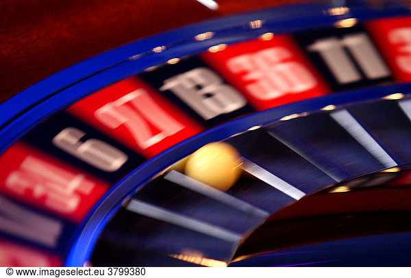 Casino in Berlin center. Roulette with a ball on the 27 rotating  blurred.