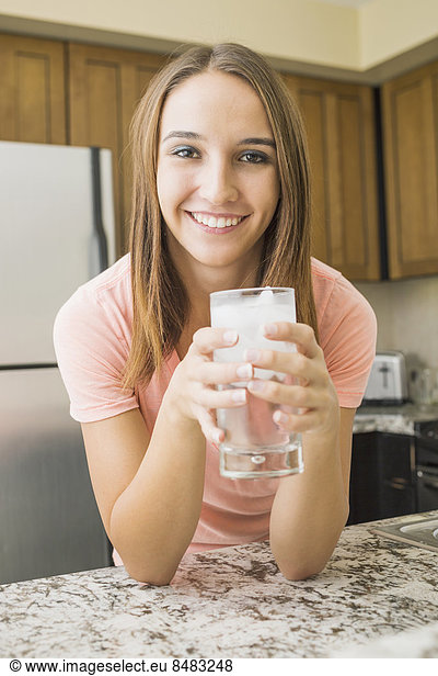 Caucasian woman drinking glass of water