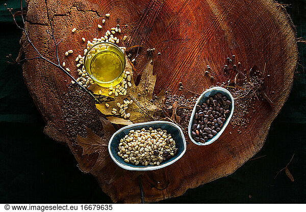 Cedar oil and pine cones on wooden background