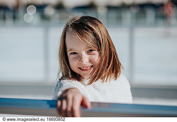 center portrait of a young girl outside on a sunny winter day