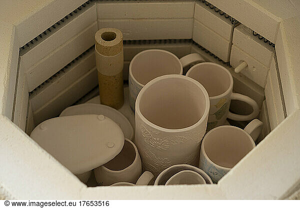 Ceramics crockery kept in hexagon shape container