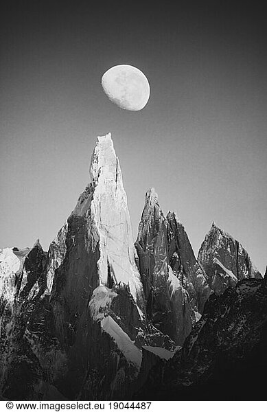 Cerro Torre and the moon in black and white