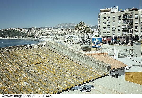 Ceuta  city center  view of the promenade and the city beach La Ribera  on the roof a discarded torn trousers  Ceuta  Spain  Europe
