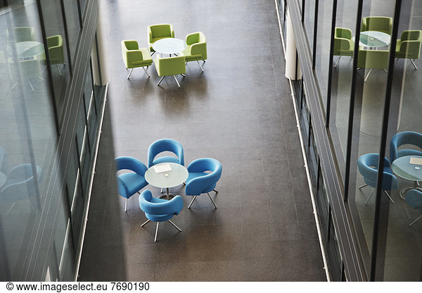 Chairs and tables in office lobby area