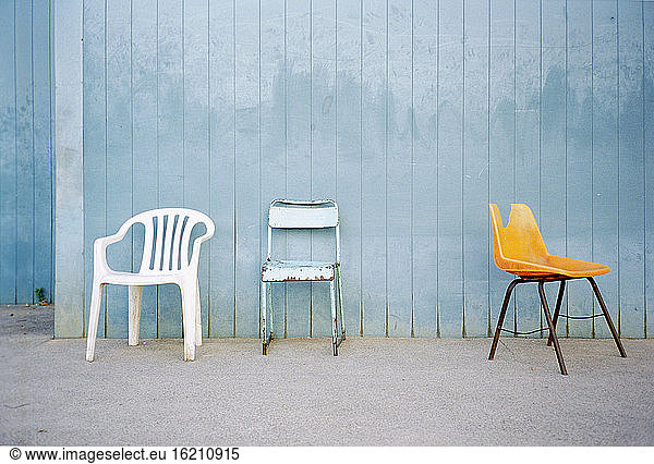 Chairs by wall