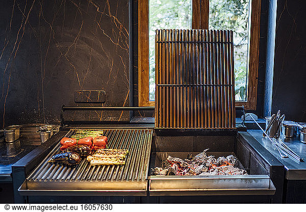 Charcoal and grilled vegetables in restaurant kitchen