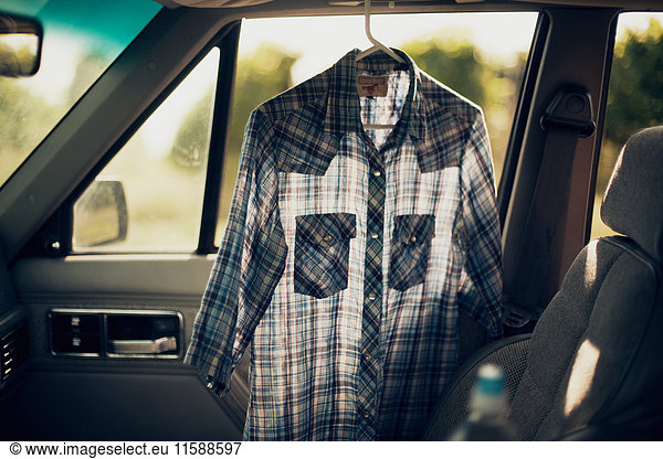 Checkered shirt in a car