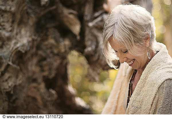 Cheerful mature woman in park