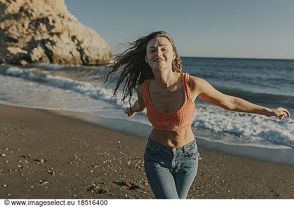 Cheerful woman enjoying at beach