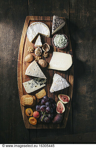Cheese platter with fruits and nuts