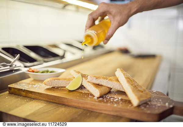 Chef preparing appetizers in commercial kitchen