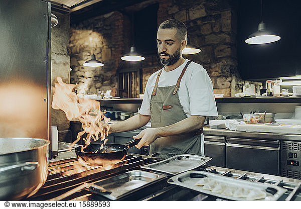Chef preparing food in restaurant kitchen