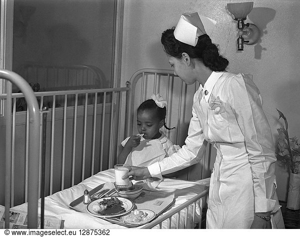 CHICAGO: HOSPITAL  1942. A nurse serving lunch in the children's ward at Provident Hospital  one of the few African-American hospitals with an African-American staff in Chicago  Illinois. Photograph by Jack Delano  1942.