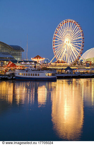 Chicago  Illinois Boat Leaving Navy Pier At Night  Ferris Wheel  Lights Reflected In Water Of Lake Michigan