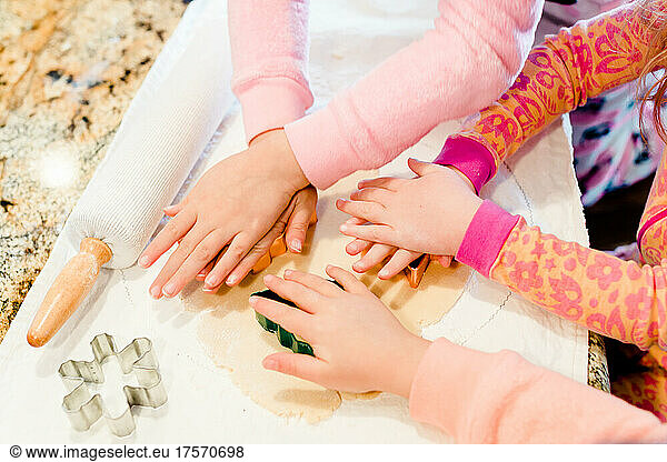 Child Hands Using Cookie Cutters