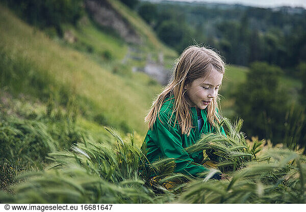 Child Playing in Tall Grass on a Hillside in Belgrade  Serbia