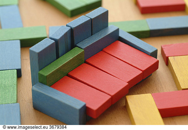 Child plays with building blocks