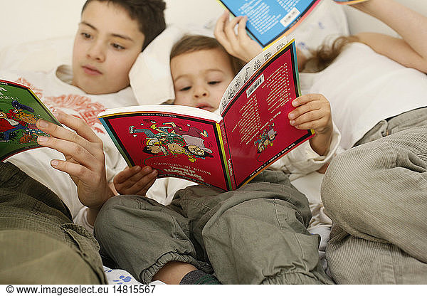 CHILD READING INDOORS