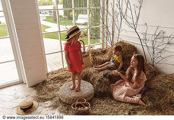 Children at Easter with rabbits and ducks