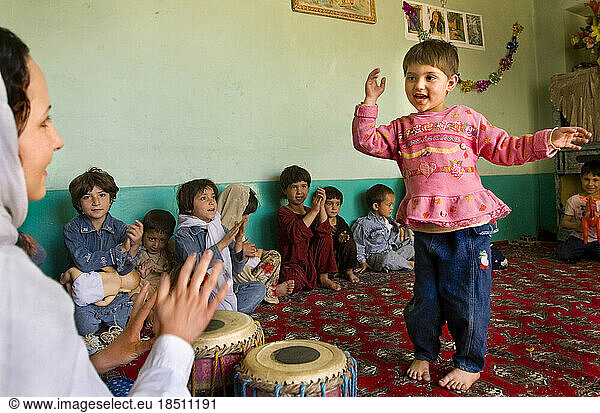 Children dance at a day care center in Kabul  Afghanistan.