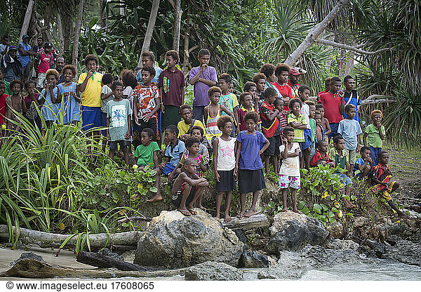 Children gathered on the shore of Tuam Island of the Siassi  Papua New Guinea; Tuam Island  Siassi Islands  Papua New Guinea