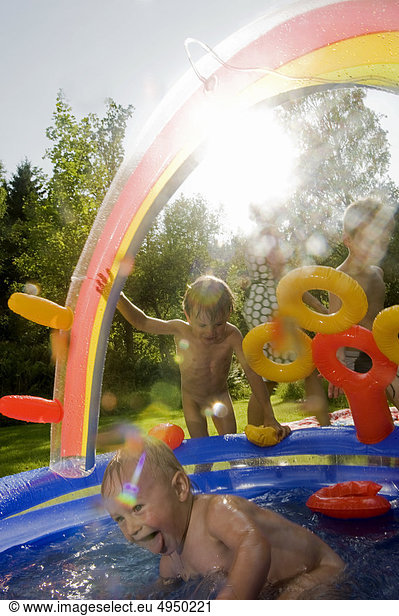 children-playing-in-paddling-pool-children-playing-in-paddling-pool-1