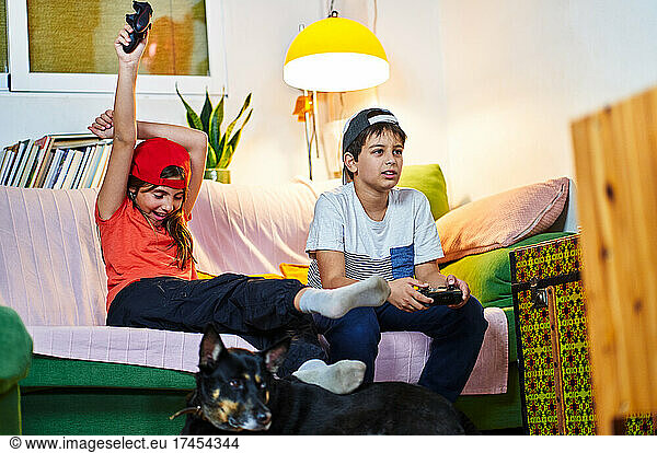 children playing video games at home