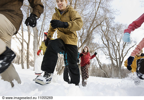 Children running across the snow.