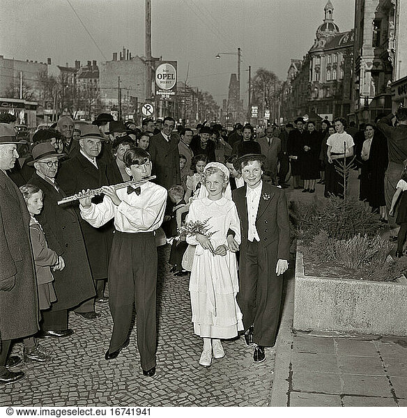 Children’s Games / Role Play. Children dressed up as bride and groom at Kurfürstendamm  Berlin. Photo  undated  early 1950's.